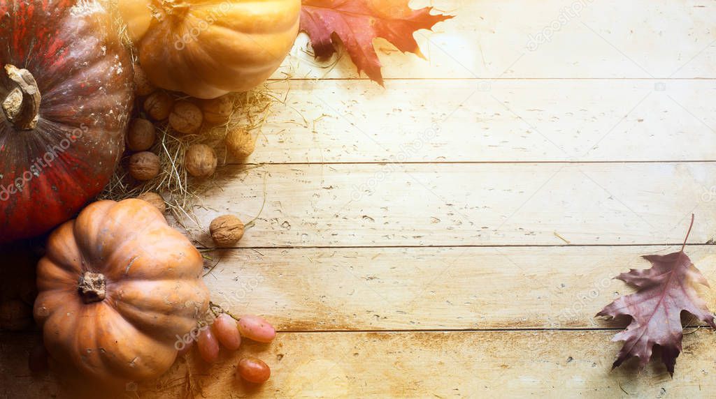 Pumpkin on wooden background; thanksgiving ar