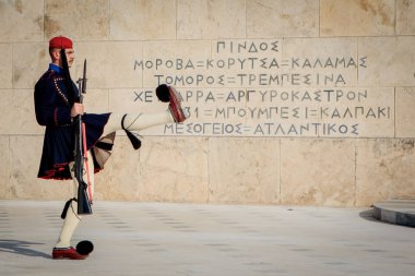 Athens, Greece - October 24, 2018: Changing of the guard in front of the Tomb of the Unknown Soldier, located in front of the Greek Parliament Building on Syntagma Square. clipart