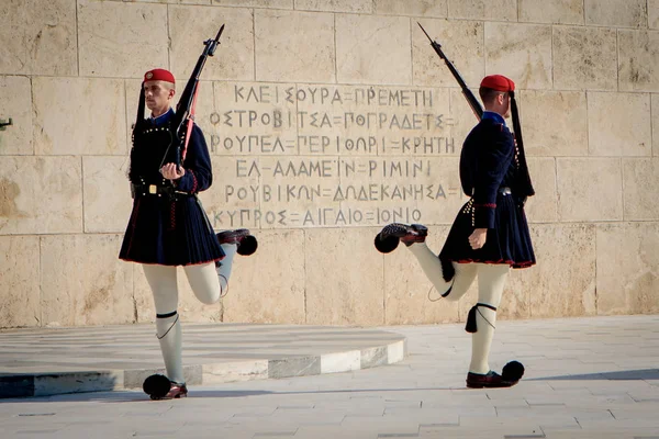 Athens, Greece - October 24, 2018: Changing of the guard in front of the Tomb of the Unknown Soldier, located in front of the Greek Parliament Building on Syntagma Square.