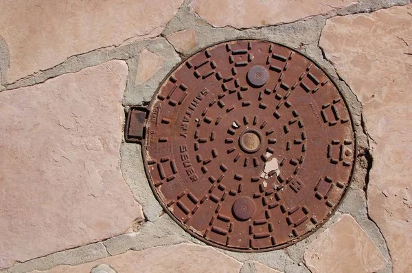 Cast Iron Sewer Cover Access Plate Stone Sidewalk — Stock Photo, Image