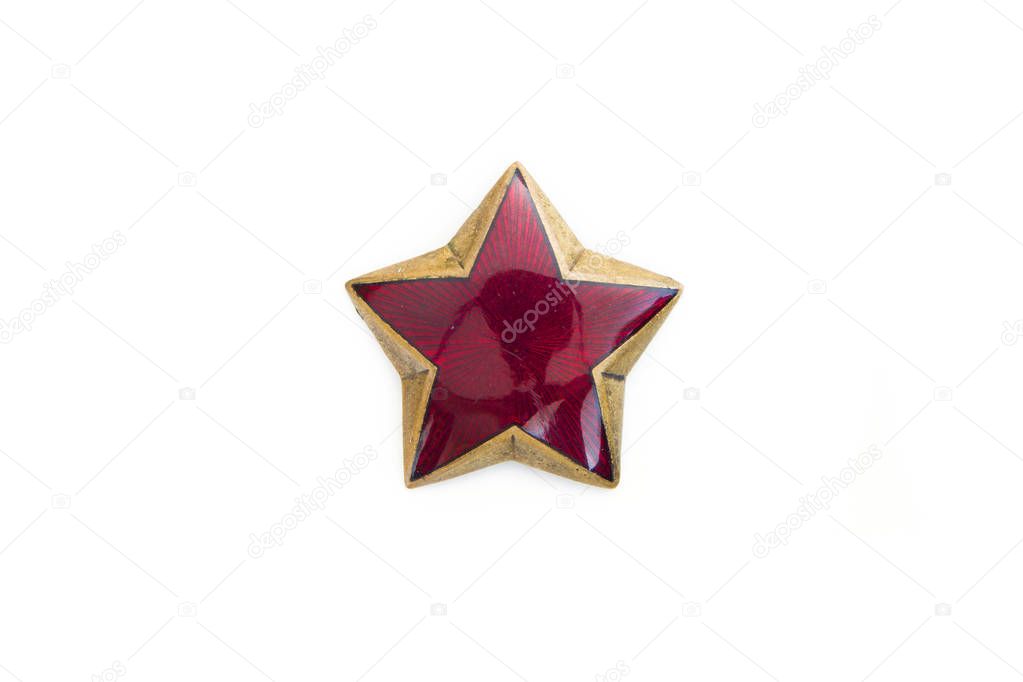 Old red star from communist military cap isolated on the white background