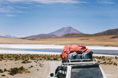 Terrain vehicle in Dali desert at Eduardo Avaroa Andean Fauna National Reserve in Bolivia clipart