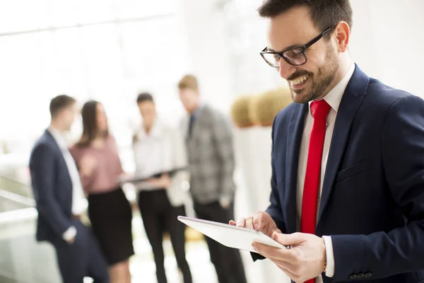 Hardworking Businessman Dressed Suit Standing Modern Office Using Tablet While — Stock Photo, Image