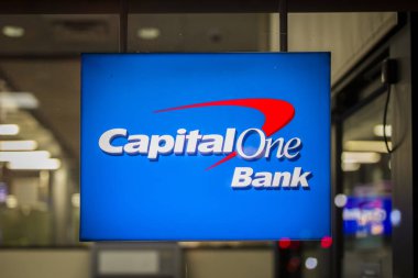 NEW YORK, USA - AUGUST 27, 2017: Sign of Capital One Bank in New York, USA. It is a bank holding company headquartered in McLean, Virginia. clipart