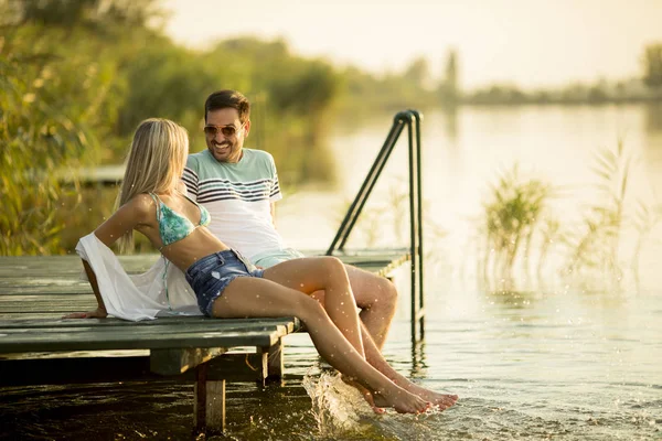 Romantic Couple Sitting Wooden Pier Lake Sunny Day — Stock Photo, Image