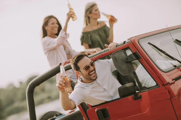 Young People Having Fun Traveling Together Convertible Car Drinking — Stock Photo, Image