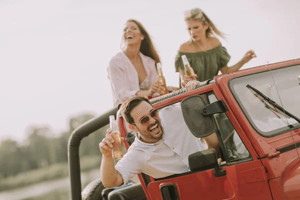 Young People Having Fun Traveling Together Convertible Car Drinking — Stock Photo, Image