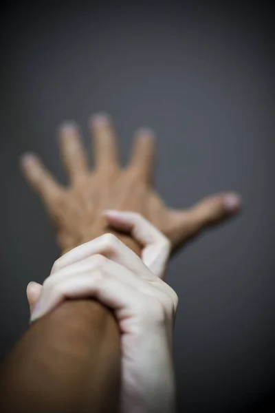 Studio Shot Woman Holding Male Hand Act Violence — Stock Photo, Image