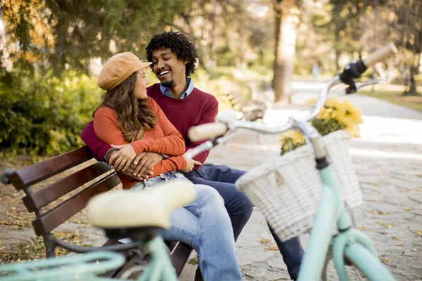 Multiratial Loving Couple Sitting Bench Autumn City Park — Stock Photo, Image