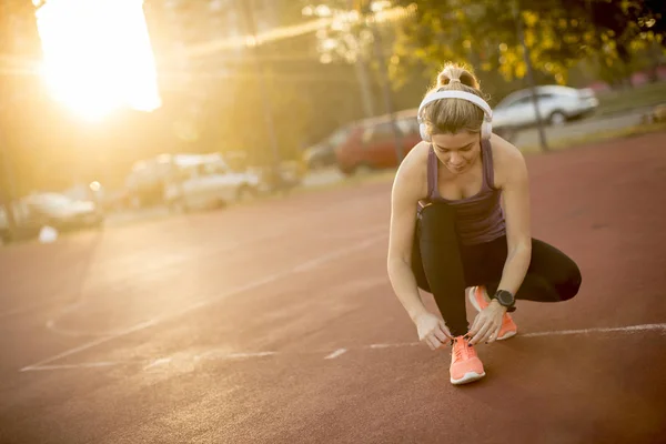 Young Beautiful Woman Athlete Earphones Listening Music Tying Laces Training — Stock Photo, Image