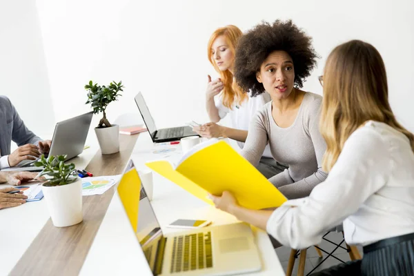 Women working together in office