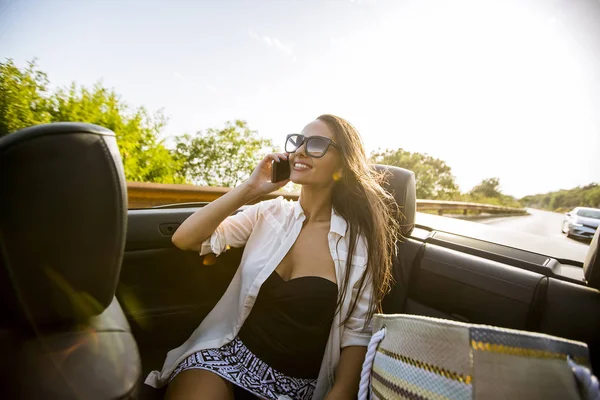Young Woman Uses Mobile Phone Sitting Cabriolet Summer Day — Stock Photo, Image
