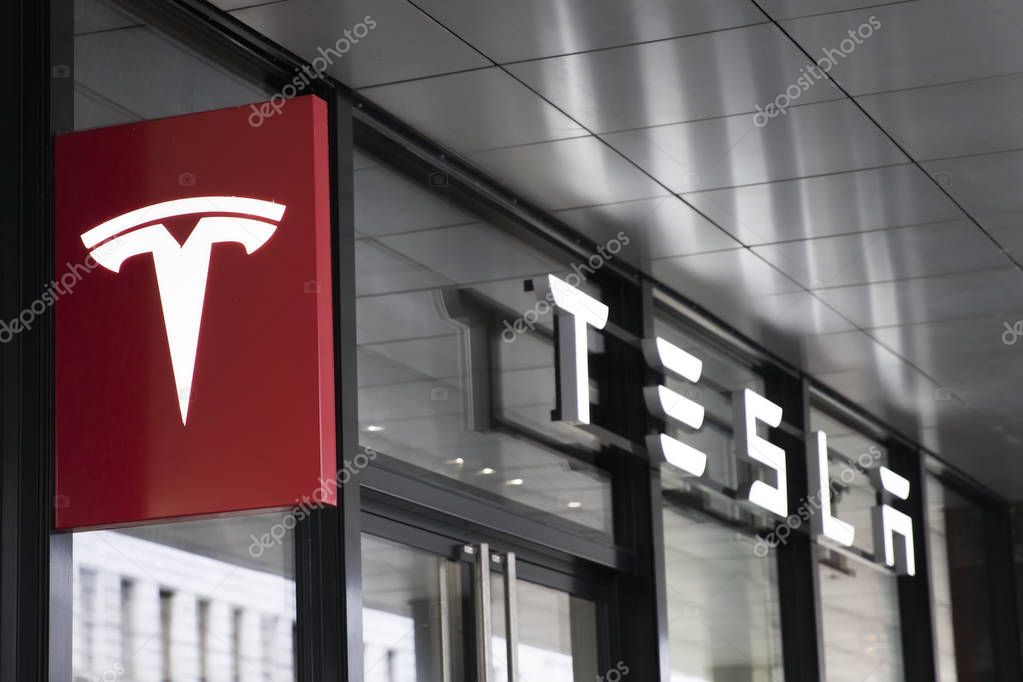 BASEL, SWITZERLAND - SEPTEMBER 24, 2018: Detail from Tesla store in Basel, Switzerland. It is an American company that specializes in electric automotives founded at 2003.