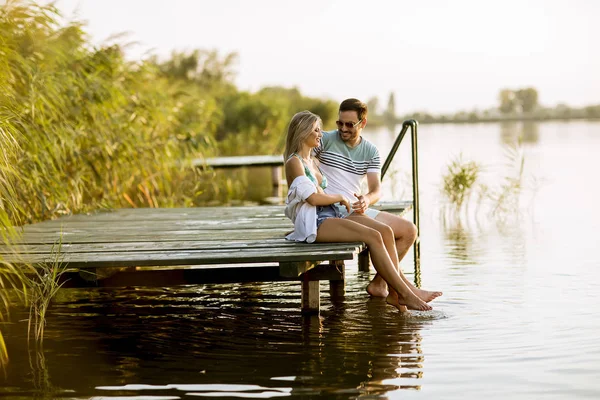 Loving Couple Sitting Pier Lake Summer Sunset — Stock Photo, Image