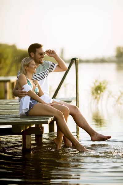 Loving Couple Sitting Pier Lake Summer Sunset — Stock Photo, Image