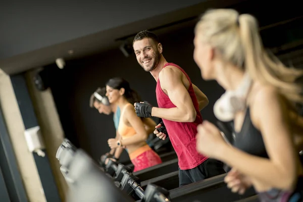 Grupo Jóvenes Corriendo Cintas Correr Gimnasio Moderno —  Fotos de Stock