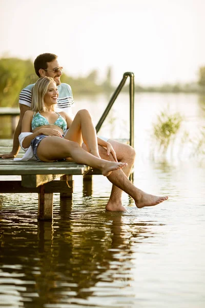 Loving Couple Sitting Pier Lake Summer Sunset — Stock Photo, Image