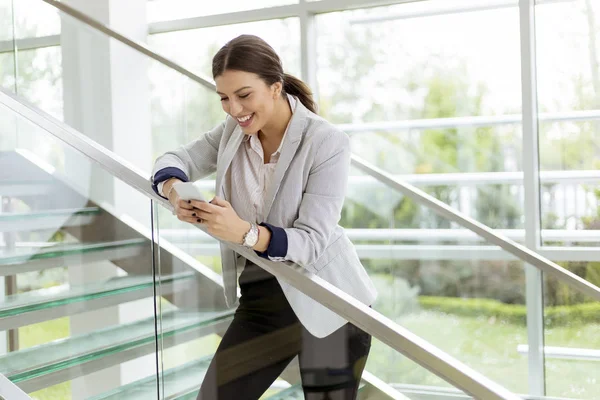 Pretty Young Business Woman Stands Stairs Office Use Mobile Phone — Stock Photo, Image