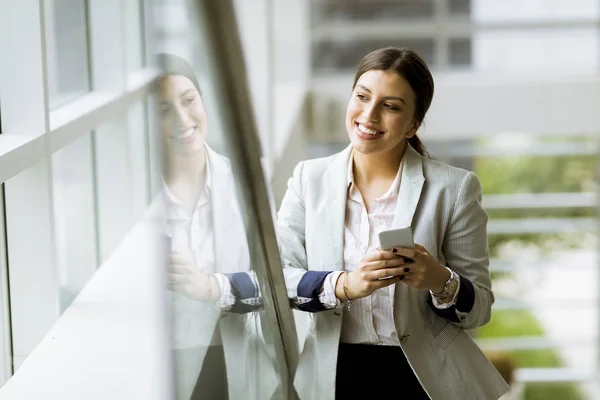 Pretty Young Business Woman Stands Stairs Office Use Mobile Phone — Stock Photo, Image