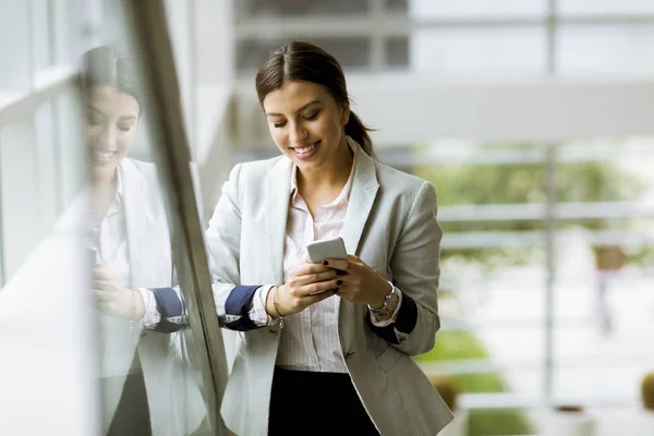 Pretty Young Business Woman Stands Stairs Office Use Mobile Phone — Stock Photo, Image