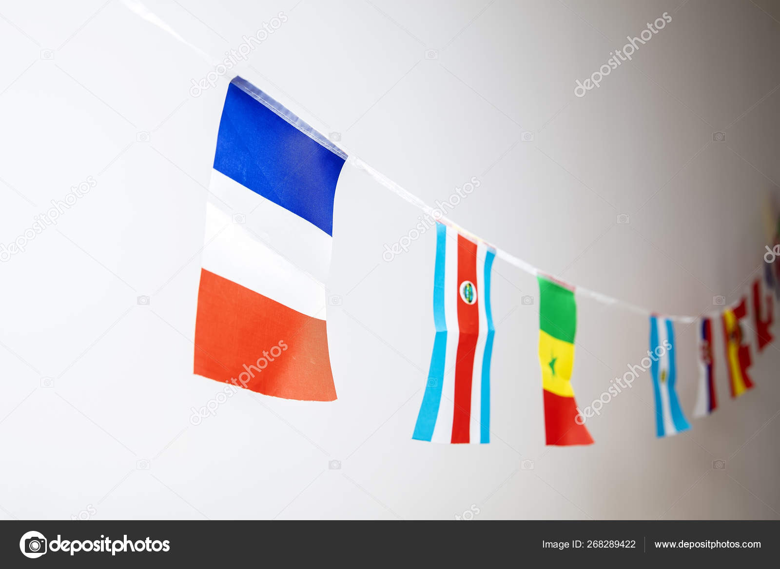 Triangle flags of various countries hanging on the rope — Stock Photo ©  boggy22 #268289422