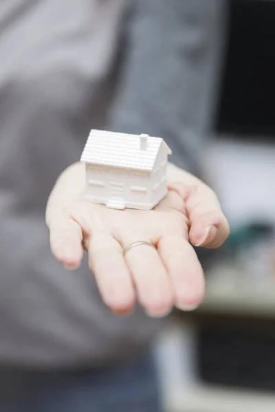 Female holding small house model, real estate concept — Stock Photo, Image