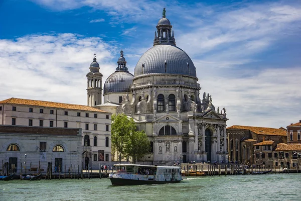 stock image VENICE, ITALY - MAY 26, 2019: Unidentified people by Basilica di Santa Maria della Salute in Venice, Italy. It  is a Roman Catholic church consecrated at 1681.