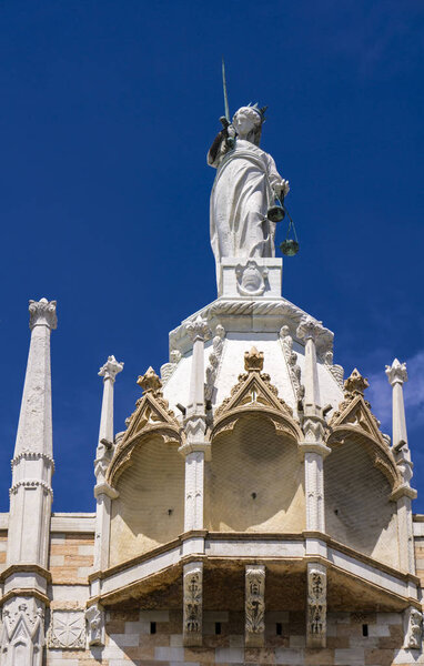 Architectural details from the upper part of facade of San Marco in Venice, Italy under blue sky