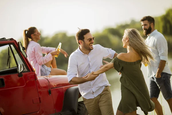 Four Young People Having Fun Convertible Car River — Stock Photo, Image