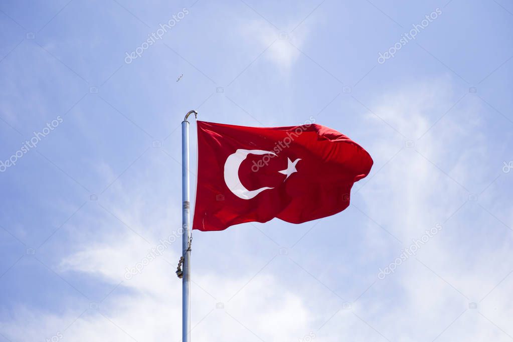 View at Turkish flag waving in the wind at blue sky