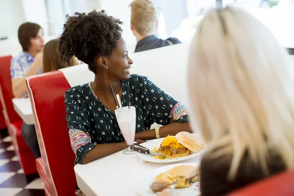 Multiracial Young Female Friends Eating Fast Food Table Diner — Stock Photo, Image