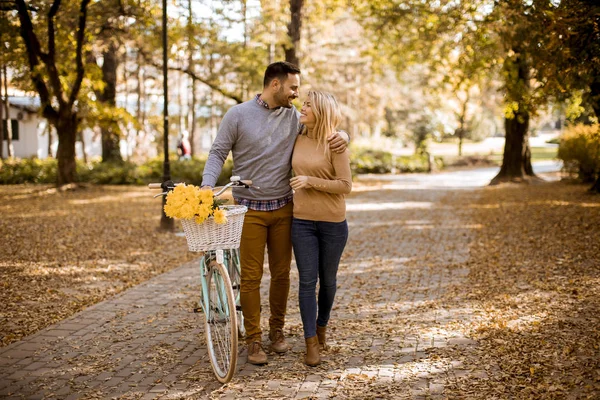 Active Young Couple Enjoying Together Riding Bicycle Golden Autumn Park — Stock Photo, Image