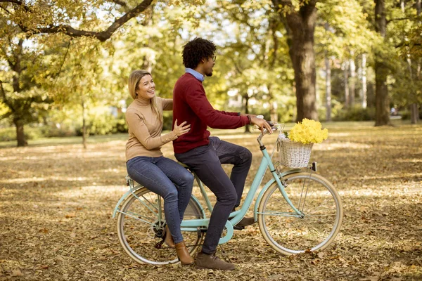 Multiracial Young Couple Riding Bicycle Autumn Park — Stock Photo, Image