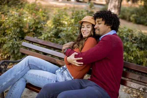 Multiratial Young Loving Couple Sitting Bench Autumn City Park — Stock Photo, Image