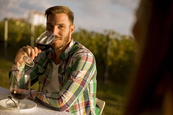 Handsome Young Man Sitting Table Drinking Red Wine Vineyard Sunset — Stock Photo, Image