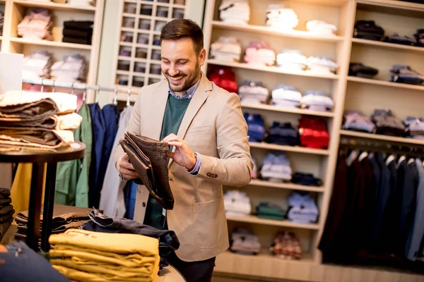 Handsome Young Man Buying Trousers Store — Stock Photo, Image