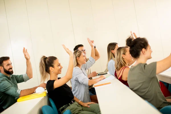 Group University Srudents Classroom Hands Raised — Stock Photo, Image