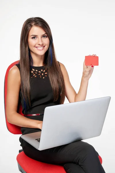 Business woman sitting on office chair working with laptop — Stock Photo, Image