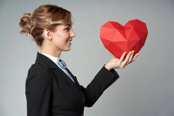 Business woman holding heart shape — Stock Photo, Image