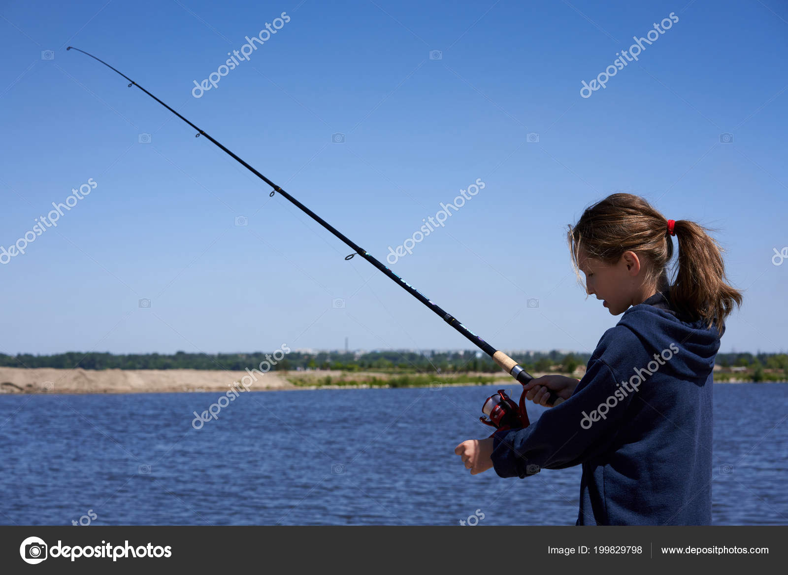 Little girl with a fishing rod Stock Photo by ©pavel_kolotenko