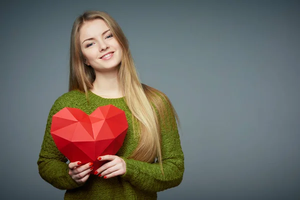 Portret van mooi blond meisje in trui — Stockfoto