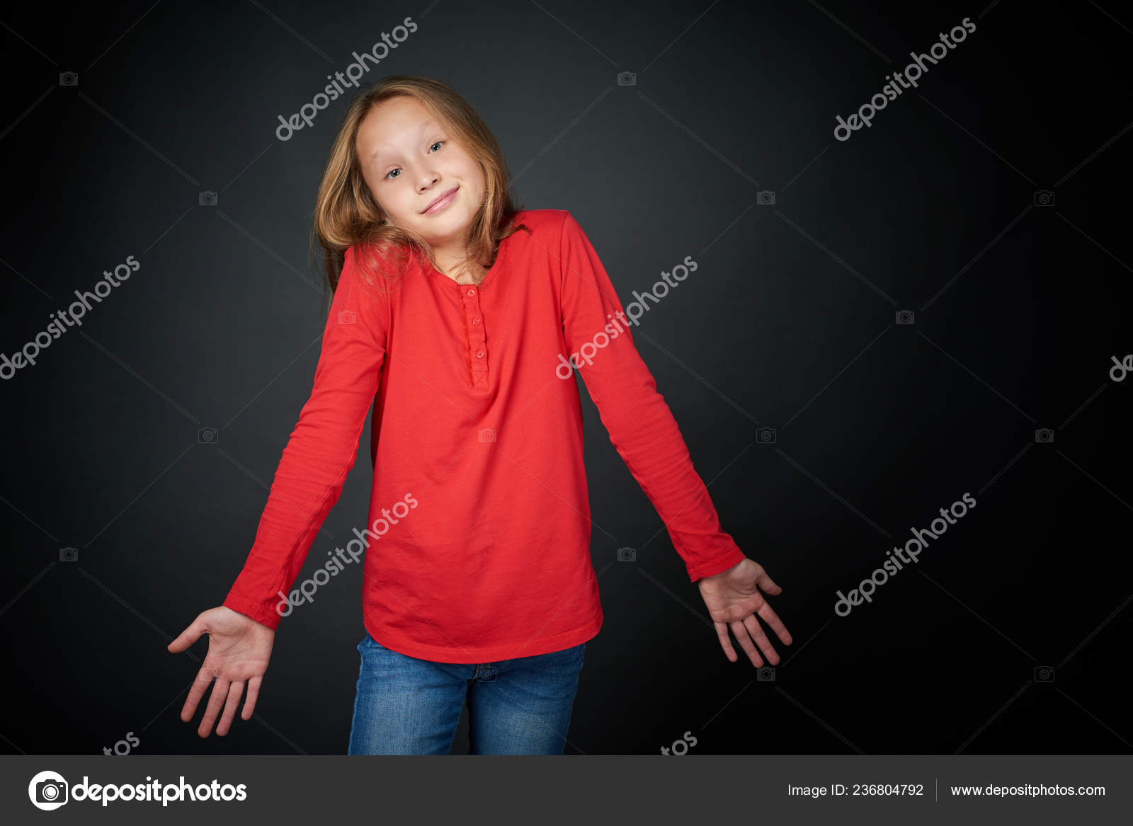 Little girl shrugging her shoulders Stock Photo by ©pavel_kolotenko
