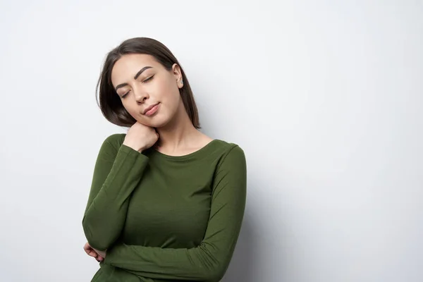 Young smiling brunette woman dreaming with closed eyes — Stock Photo, Image