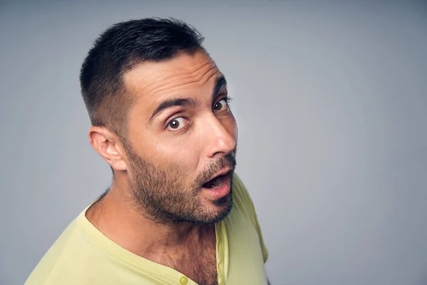 Closeup of hispanic man peeking in camera — Stock Photo, Image