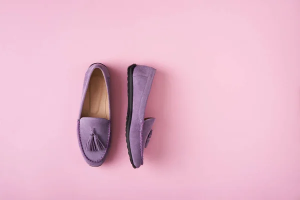 Lilac suede moccasins shoes over lilac pink background — Stock Photo, Image