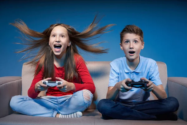 Computer game competition. Gaming concept. Excited girl playing video game with joystick — Stock Photo, Image