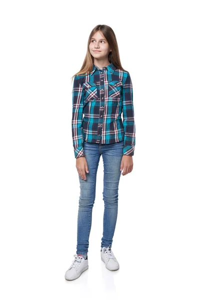 Teen girl in checkered shirt standing casually — Stock Photo, Image