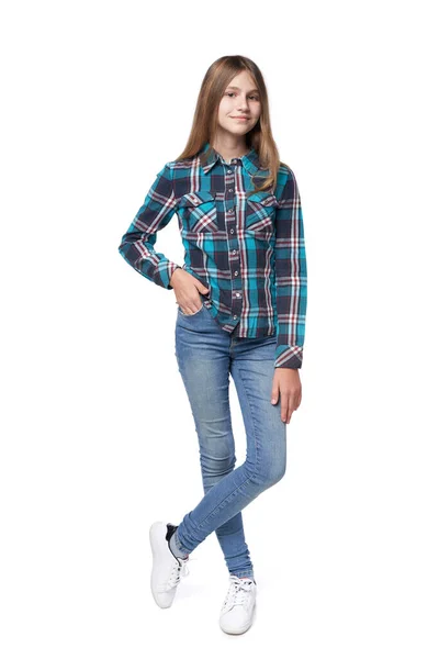 Teen girl in checkered shirt standing casually — Stock Photo, Image