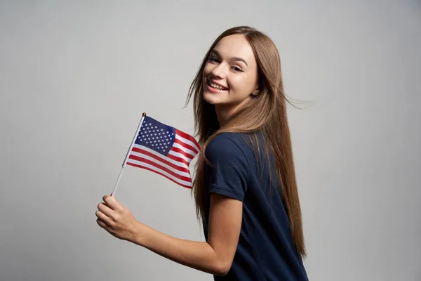 Happy female holding USA flag — Stock Photo, Image