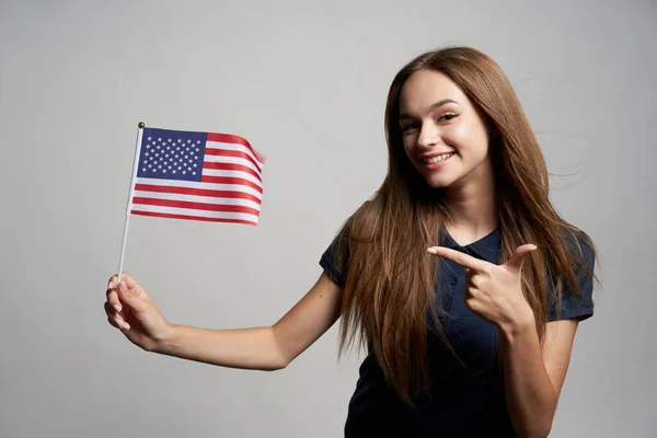 Happy female holding USA flag — Stock Photo, Image